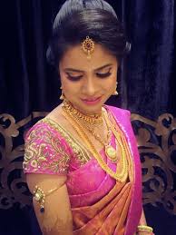 Along with an incredible display of bridal fashion silks like the kanchipuram or banarasi silks, and some unforgettable traditional and modern gold jewellery, you know that hairstyles are a definite component to complete the bride's wedding profile. Traditional Southern Indian Bride Wearing Bridal Silk Saree And Jewellery Reception Look Makeup And Indian Bride South Indian Bride Wedding Saree Collection