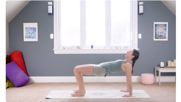 Yoga mat set beside the bed for morning
