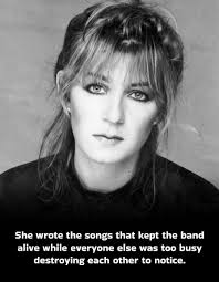 At top is a black and white photograph of a woman with her hand by her face  with two rings