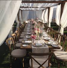 Outdoor Reception Unreal Team Table Setup White Tent Chiffon Drapes Wooden Tables And Chairs Country Styl Outdoor Pergola Pergola Wooden Table And Chairs