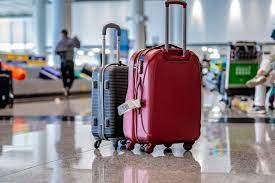 A United Airlines passenger checking in luggage at the airport counter, with staff assisting. This image reflects the airline&rsquo;s baggage policy and in-person customer support experience. It visually reinforces the blog section discussing carry-on allowances, checked baggage fees, and packing tips.