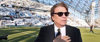 French businessman bernard tapie (c) talks to lawyers as he leaves a paris courthouse on march 21 © afp. Bernard Tapie Jubile Apres La Qualification De L Om En Finale De La Ligue Europa Le Point