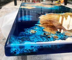 This beautiful coffee table has been built from 100% reclaimed wood and comes with a roomy storage deck underneath for storing books, magazines, and decor. Blue River Epoxy Coffee Table