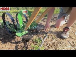 Because the tool bar on our wheel hoe has multiple attachment holes and slots, there are endless possibilities for configurations of our wheel hoe attachments. Hilling Potatoes With The High Arch Wheel Hoe Youtube