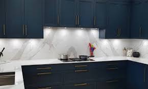 The background is a translucent white with gray, blue and taupe veins and burgundy patches running throughout. White Quartz Countertops That Look Like Marble Countertops For Kitchen