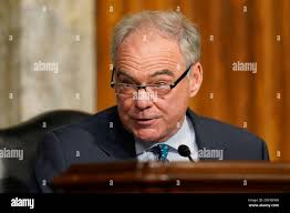 Sen. Tim Kaine, D-Va., speaks to reporters about a war powers resolution  regarding Venezuela