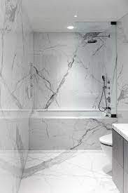 The bathrooms were one of the biggest renovations in my new condo. Span Architecture Gut Renovates Upper East Side Duplex Marble Tile Bathroom White Marble Bathrooms Carrara Marble Bathroom