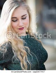 A darker red lipstick will inevitably look gothy, while a bright red will soften your overall look. Blue Eyed Blond Teenage Girl With Lipstick And Green Tshirt Portrait Of A Blond Teenage Girl With Long Hair Wearing Dark Red Canstock