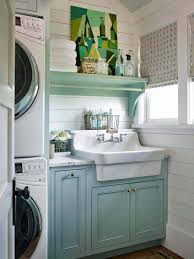 Gray laundry room features enclosed washer and dryer sandwiched between gray shaker cabinets at the top and a. 35 Clever Ways To Create Functional And Stylish Small Laundry Rooms