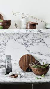H M Home A Contemporary Kitchen Dream With Carrara Marble And Wooden Kitchenware H M Home Contemporary Style Kitchen Contemporary Home Decor
