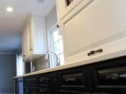 Think white cabinets above the sink paired with shades of blue, black, or brown below. Dark Lower Cabinets And Light Upper Cabinets In Kitchen Hgtv