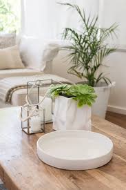 Get yourself some serenity now just by smelling this candle. Coffee Table With Candles And Succulents By Gillian Vann