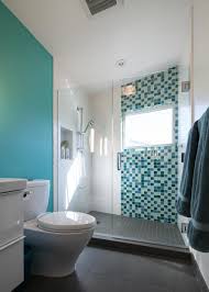 Check out our decorative accent shower tiles selection for the very best in unique or custom, handmade pieces from our shops. Contemporary Bathroom With Turquoise Accent Wall Glass Shower Door And Turquoise And Green Glass Tile Shower Decoration Hgtv