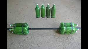 1 fill water into each water bottle, either full or as much as you would like them to weigh. How To Make Homemade Barbell Without Cement Youtube