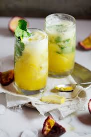 Fresh Pineapple Passion Fruit Mojito Simply Delicious Recipe Passion Fruit Mojito Food Yummy Drinks