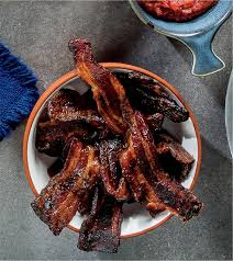 The exact baking time will depend on the how thick your bacon is and how crisp you like it. Milk Stout Glazed Thick Cut Bacon