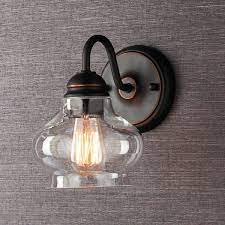 In contrast, the clear glass surround is barely there, echoing the form of a shade. Clear Cloche Glass Sconce Rustic Bathroom Lighting Bathroom Light Fixtures Unique Light Fixtures