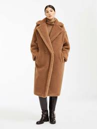 It's cut from the finest camel hair felt for a cosy, oversized silhouette, and lined in satin to ensure it waist tie. The Iconic Winter Coat That S Beloved By The Fashion Set Elle Canada