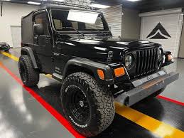Image result for Brilliant Black 2005 Jeep
