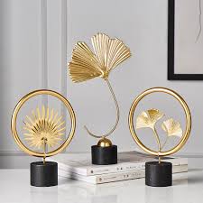 Get 5% in rewards with club o! Creative Gold Home Decoration Accessories Modern Flowers Ornaments Miniature Metal Figurinas Gift Home Decor Living Room Office Leather Bag