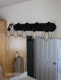 Crafted from stainless steel, this fixture. Bathroom Light Fixture Makeover Sawdust Sisters