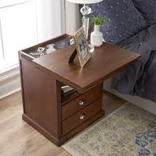 It has a full sized drawer for various bedside items and open storage space beneath the drawer, but it also features two concealed compartments, one located above and one below the main drawer to hold personal effects, a pistol or other small items. The Hidden Compartment Night Stand Hammacher Schlemmer