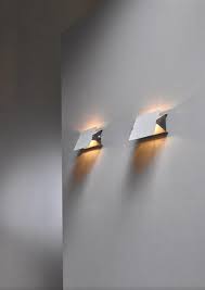 Pair of early Charlotte Perriand CP1 enamel wall appliques | Bloomberry