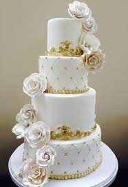 All White Wedding Cake With Gold Accents Gold Wedding Cake Royal Wedding Cake White Wedding Cakes