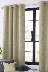 Plaid fabric takes these roman shades to the next level. Buy Tweedy Twist Curtains From Next Germany