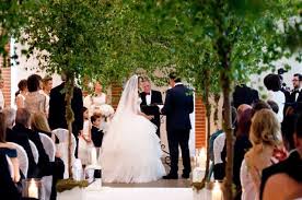 Hayley bray has been photographing weddings for many years and loves to capture candid moments including all the nerves, smiles and raw emotion. Great Fosters Orangery Silver Birch Trees Line The Aisle Hayley Bray Photography Lilys Flowers