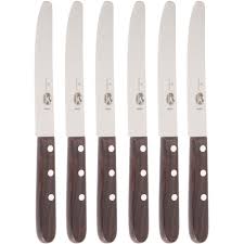 Steak knives are small, sharp table knives that often come with serrated blades and wooden handles, designed for cutting steak. Victorinox 46058 Rosewood 5 1 4 Round Tip Serrated Steak Knife Set 6 Set