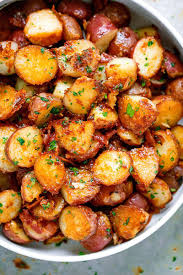 Roasted Garlic Potatoes With Butter Parmesan Best Roasted Potatoes Potato Side Dishes Parmesan Potato Recipe Recipes