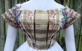It reaches to the waist and has a point in front and back. All The Pretty Dresses 1860 S Ballgown Bodice In Floral Print