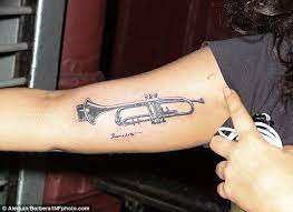 Aug 11, 2017 · dwayne johnson's bull tattoo on his right bicep has become the star's signature ink since his early pro wrestling days. Lady Gaga Gets Trumpet Tattoo On Her Upper Arm Trumpet Tattoo Lady Gaga Tattoo Tattoos