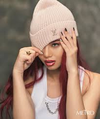 With her striking red hair and intense gaze, #MikhaLim is effortlessly  cool. But this BINI member is also humble and unafraid to speak her truth.  “I don't really like talking about being