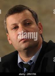 In this Oct. 30, 2010 photo, Black Hills State's Chase Tyson, left, and Scott  Boner, right, take down South Dakota School of Mines & Technology's Lukas  VanLaecken during a college football game