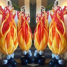 Red, yellow or orange icing (or a swirl of all three) can be used to top the cupcakes wrapped in red, orange, or yellow cupcake wrappers. Image Result For Fire And Ice Balloon Decor Balloon Decorations Party Balloons Balloons