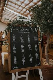 Chic Chalkboard Wedding Seating Chart Sign With Olive Foliage Seating Chart Wedding Wedding Table Plan Wedding Table Seating Chart