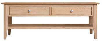 All pieces in the paradise retreat coffee table are created from solid malaysian oak and carved around the edges with subtly exotic motifs. Scandia Light Oak Large Coffee Table With Drawers