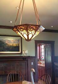 The high quality, raw material used for your pieces are reminiscent of the same period. Arts Crafts Craftsman Copper A James Mattson Coppercraft Chandelier Graces The Dining Room Of Craftsman Dining Room Craftsman Lighting Craftsman Decor