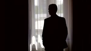 Silhouette Of Stylish Man In Suit Looking Out The Window Stock Video C Timonko 45669807 Man silhouette back going to the light at night. silhouette of stylish man in suit looking out the window