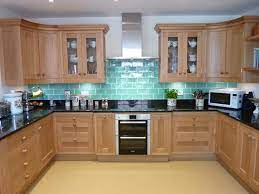 Wood tone cabinets easily create a warm look that can completely change the style of your kitchen. Handmade Oak Shaker Style Kitchen Oxfordshire