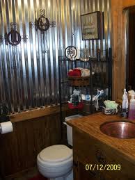 Blue wall tiles and spanish floor tiles complement the rustic wood cabinets and black fixtures. Old Western Saloon Style Bathroom Western Bathroom Decor Bathroom Decor Western Bathroom