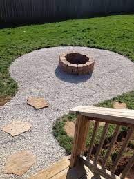 If you're constructing your fire pit in the summer, make sure you look up any restrictions your city or county may have on outdoor burns. My Backyard Firepit With Seating Area Stones From Lowes 2 25 A Piece Need 30 And 2 Bags Of Pea Grave Fire Pit Landscaping Backyard Landscaping Backyard Fire