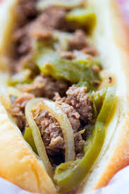 Beef, peppers and onions are simmered all day in a delicious broth. Slow Cooker Philly Cheesesteak Recipe No Plate Like Home