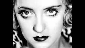 intro f am g x4 verse 1 f am g f g c her hair is harlowe gold, her lips a sweet surprise f am g c her hands are never cold, she's got bette davis eyes am f am g she'll turn the music on you f g am you won't have to think twice f am g c c7 she's pure as new york snow, she's got bette davis eyes chorus 1 am c and she'll tease you, she'll. Bette Davis Eyes Kim Carnes Lyrics On Screen Youtube
