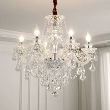 With a stunning mountain view, this dining room filled with wooden cabinets and a cozy dining set will make you feel closer to nature. China Modern Dining Room Chandeliers Classic Crystal Pendant Lamp Chandelier For Living Room Price China Crystal Lamp Chandelier Classic Chandelier