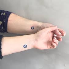 Evil eye tattoo serves the dual purpose of enhancing the appearance and warding off evil. 15 Tiny Evil Eye Tattoo Ideas To Ward Off Misfortune Evil Eye Tattoo Eye Tattoo Blue Ink Tattoos