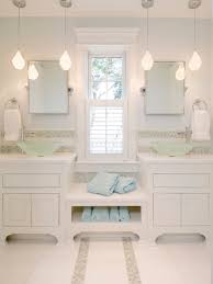 This stunning modern bathroom's lighting follows the architecture of the room for a unique finish. Bathroom Lighting Design Ideas