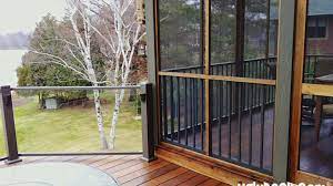 The second type of porch enclosure is the kind that is wide open with a few support beams holding up the deck above and is usually wide open. How Much Does It Cost To Enclose A Patio Minnesota Deck Builders Maintenance Free Deck And Decking Material